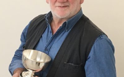 ALLAN G. HENDERSON WITH HIS TROPHY FOR THE STELLA ANNE CORMIE AWARD